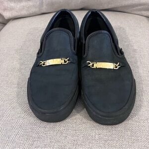 Black Slip-On Vans with Gold Accents